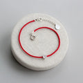 Pulsera de Plata 925 Flor de Ciruelo · Cordón Rojo